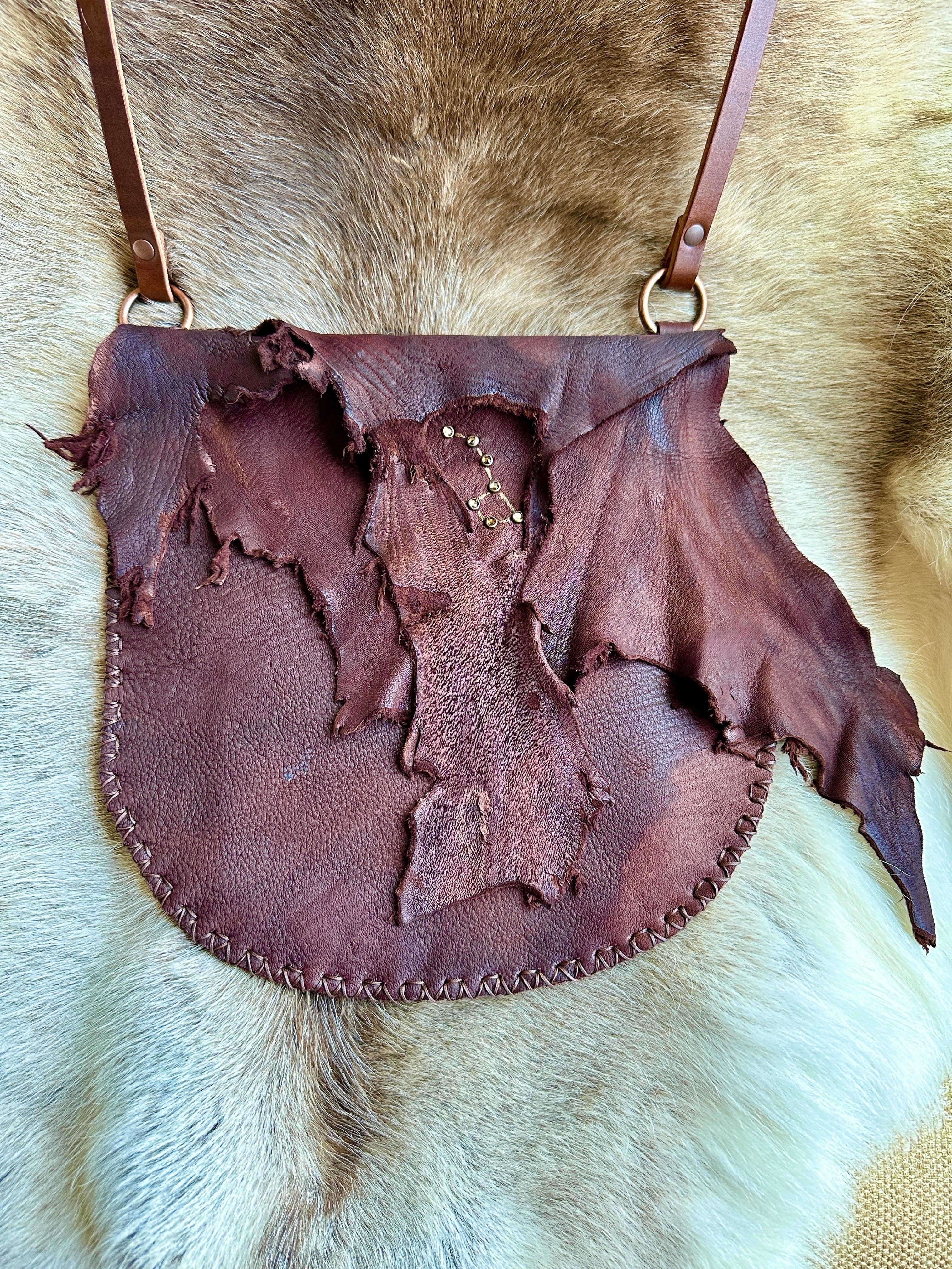 Bridger Leather Sacajawea Crossbody made with walnut brown elk hide and hand sewn.  This beautiful bag has a rugged raw edge flap and a "Big Dipper" constellation made with Swarovski crystals.  The bag is hand sewn.