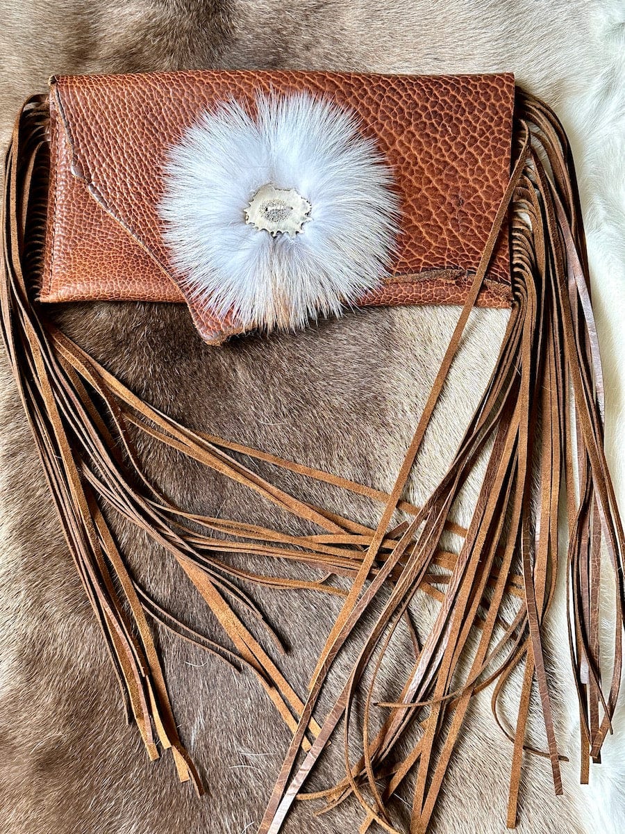 Bangtail Bison Leather Clutch | Handcrafted by Bridger Leather | Brown leather clutch with long fringe and fox fur trim