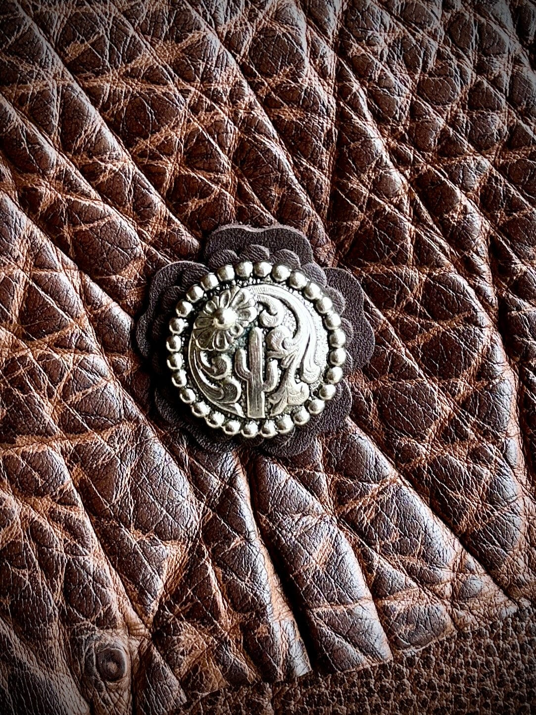 Bridger Leather Clutch Water Buffalo Clutch with concho detail.