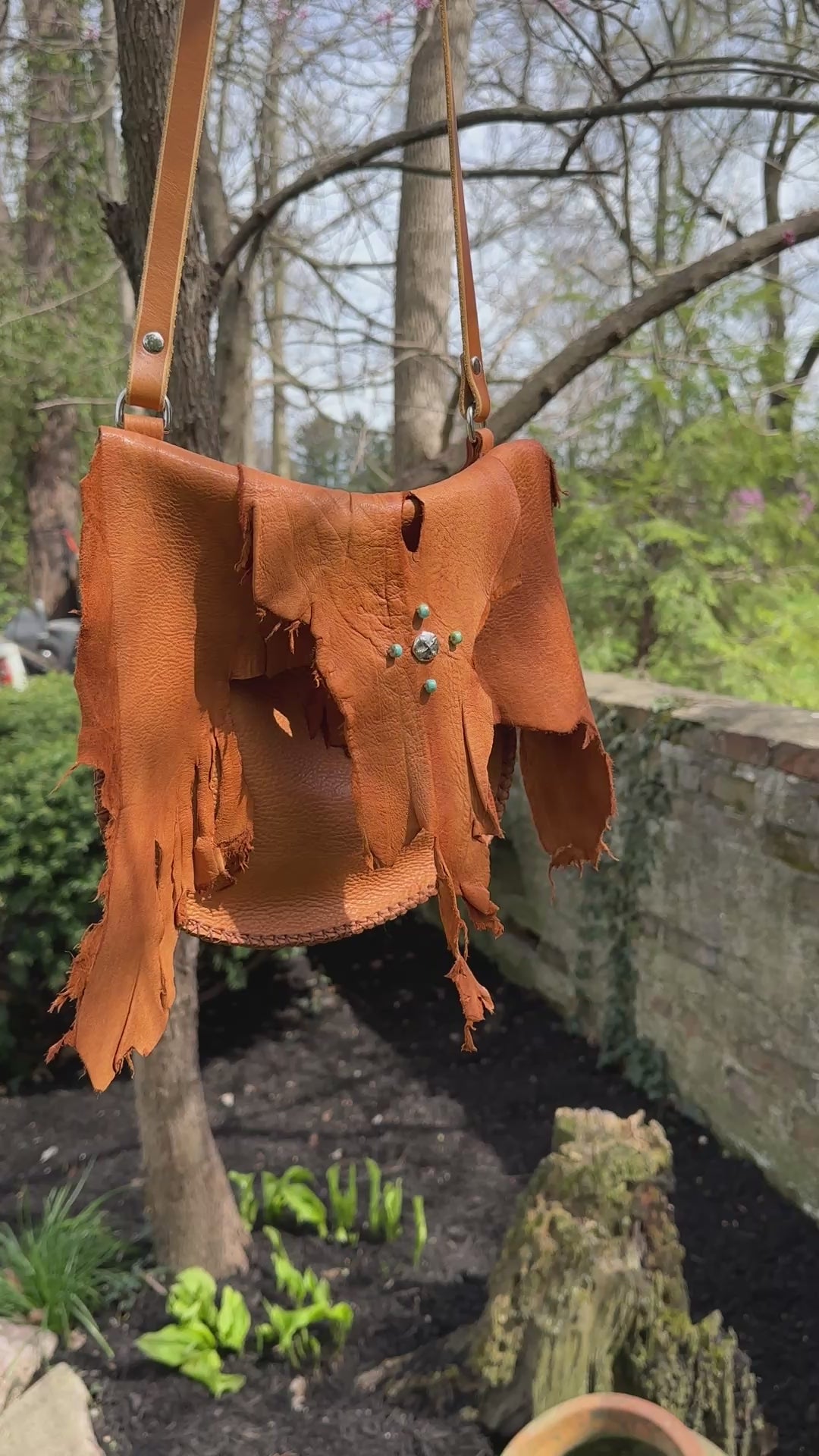 Short video of Elk Leather Crossbody bag in outdoor setting