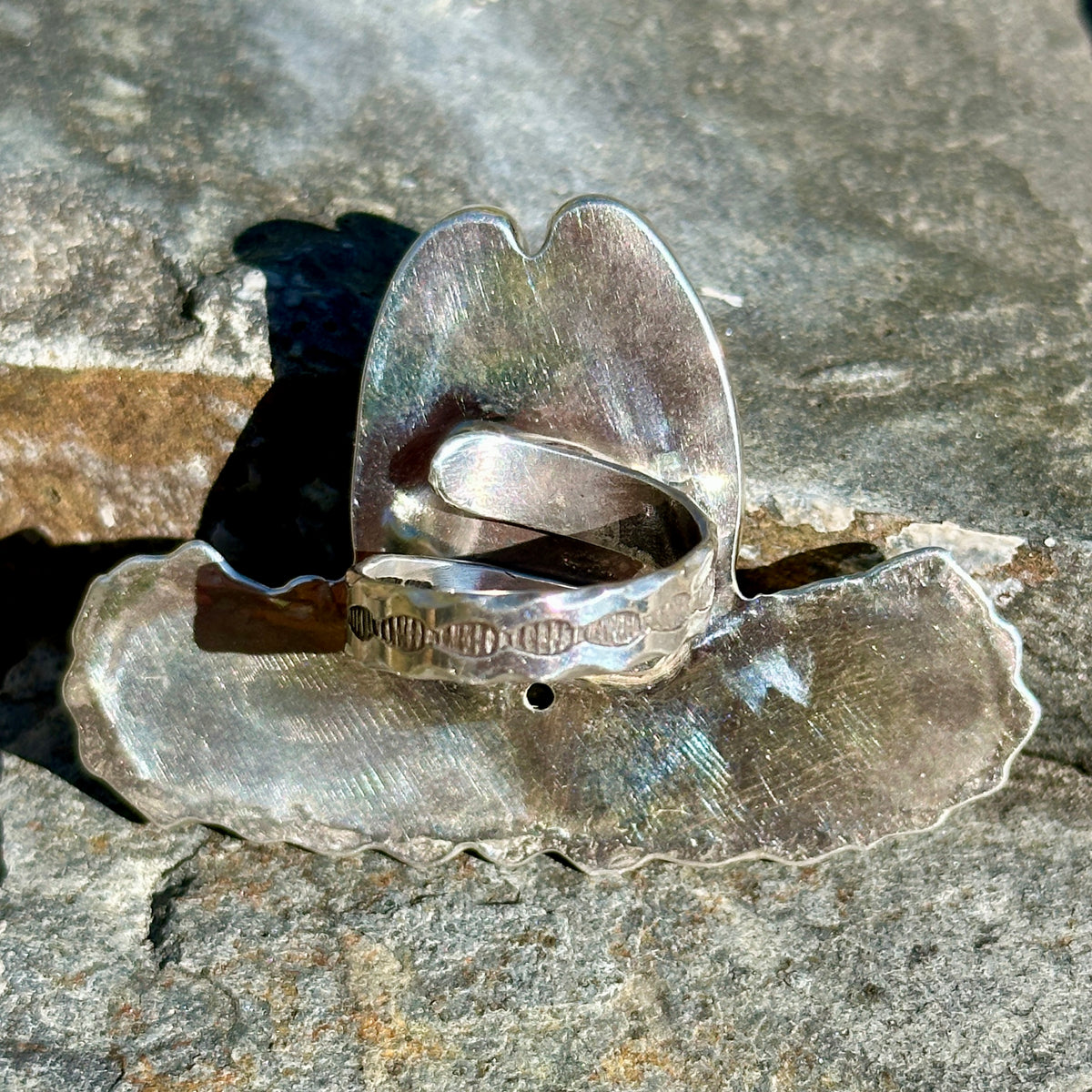 Back of the spiderweb turquoise cowgirl hat ring showing the adjustable sterling silver wrap band with hand-stamped detail