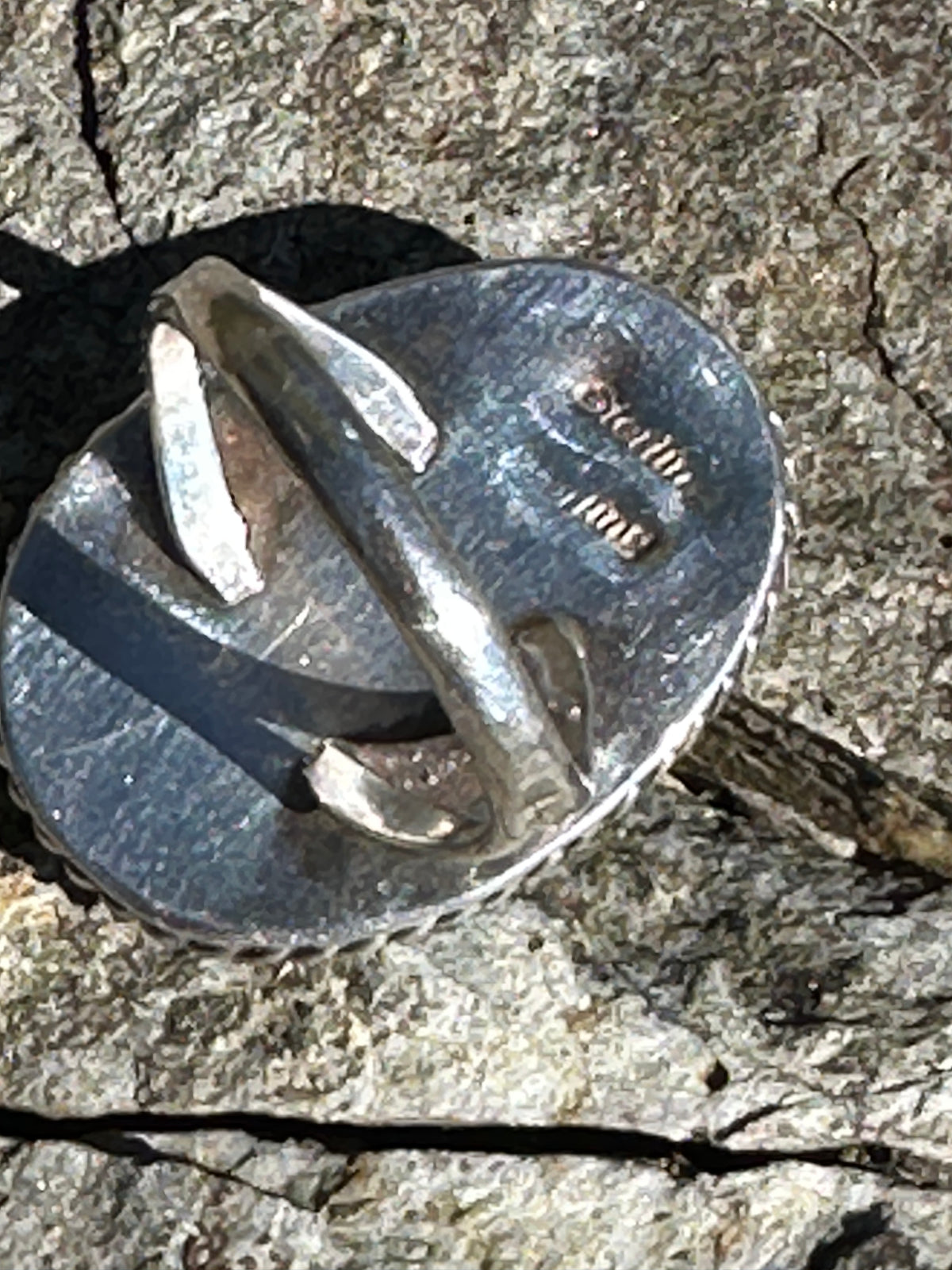 Back of the silver ring showing the Sterling stamp on the back plate and the split shank band