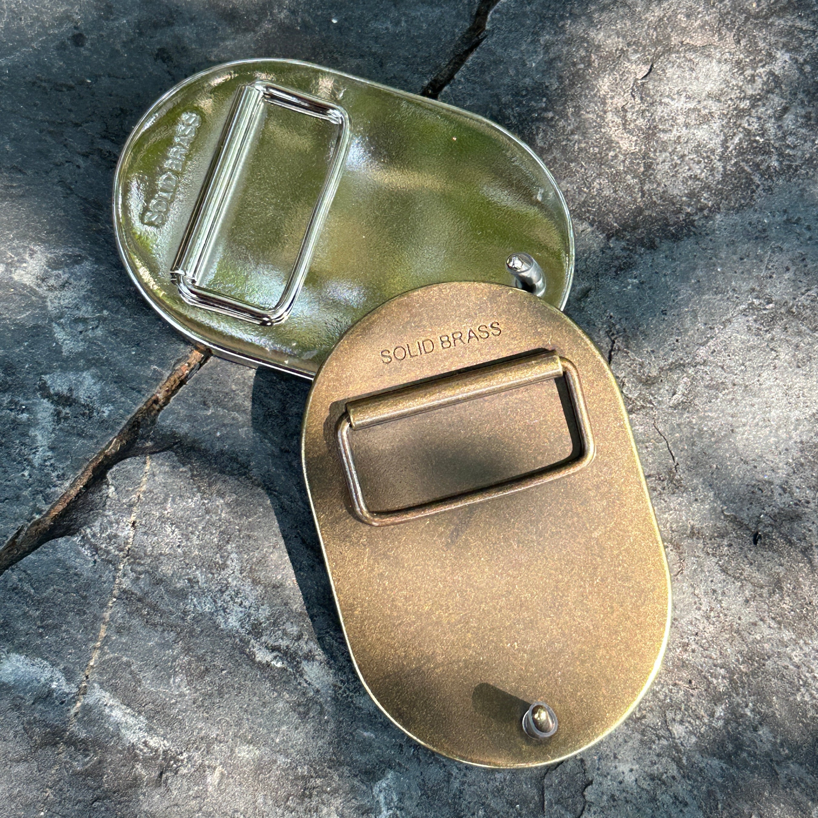 back view of brass belt buckles in nickel plate and antique brass