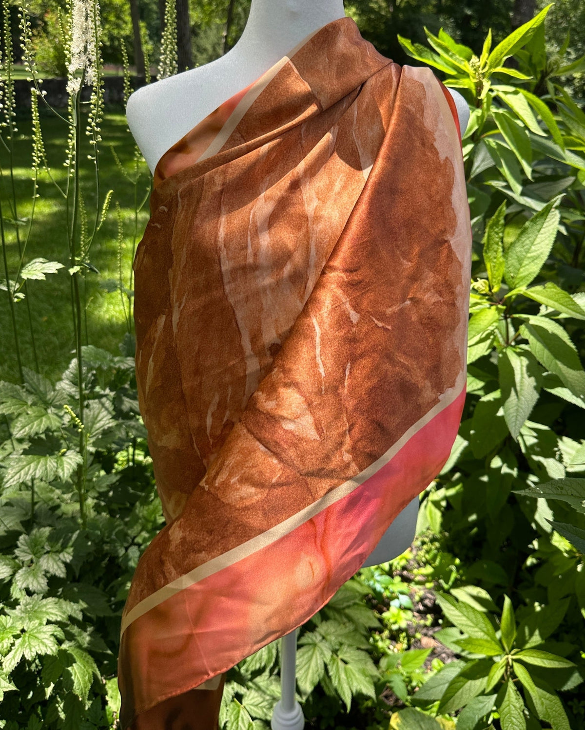 Absaroka silk scarf draped as a shawl across a mannequin, showing the full mountain print