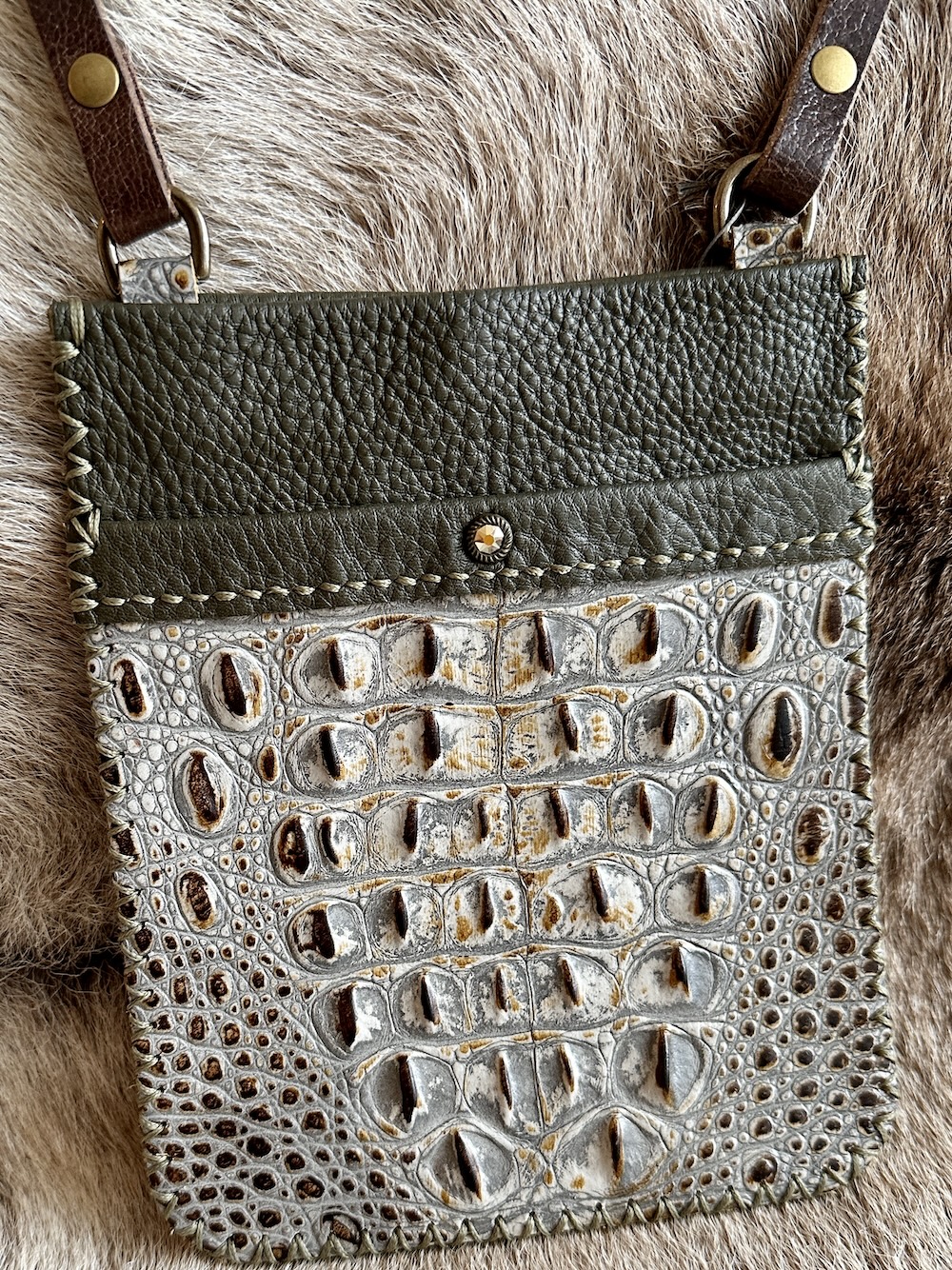 Olive leather bag with embossed crocodile pocket with brown, creams and grays.