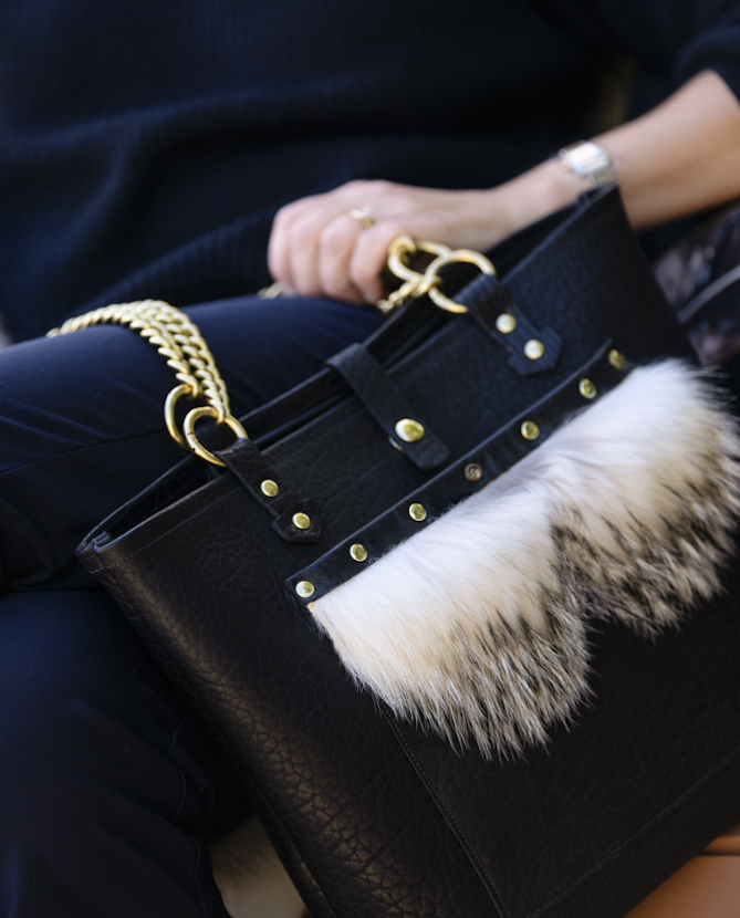 Black tote bag with badger fur trim and solid brass chain and hardware